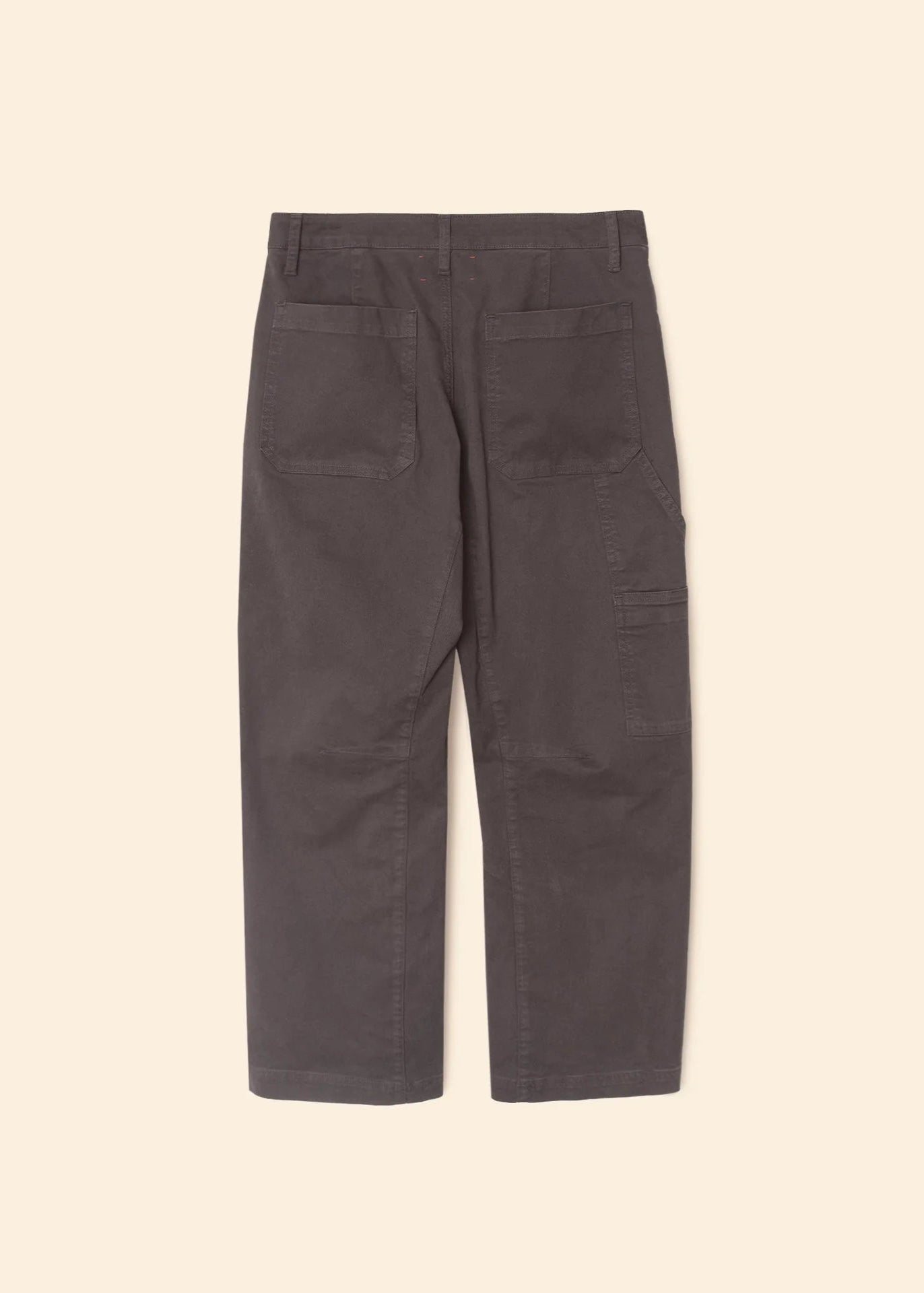 Dark gray pants on a beige background