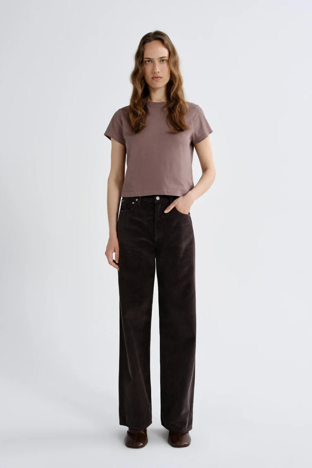 Dark brown wide-leg corduroy pants. - 1