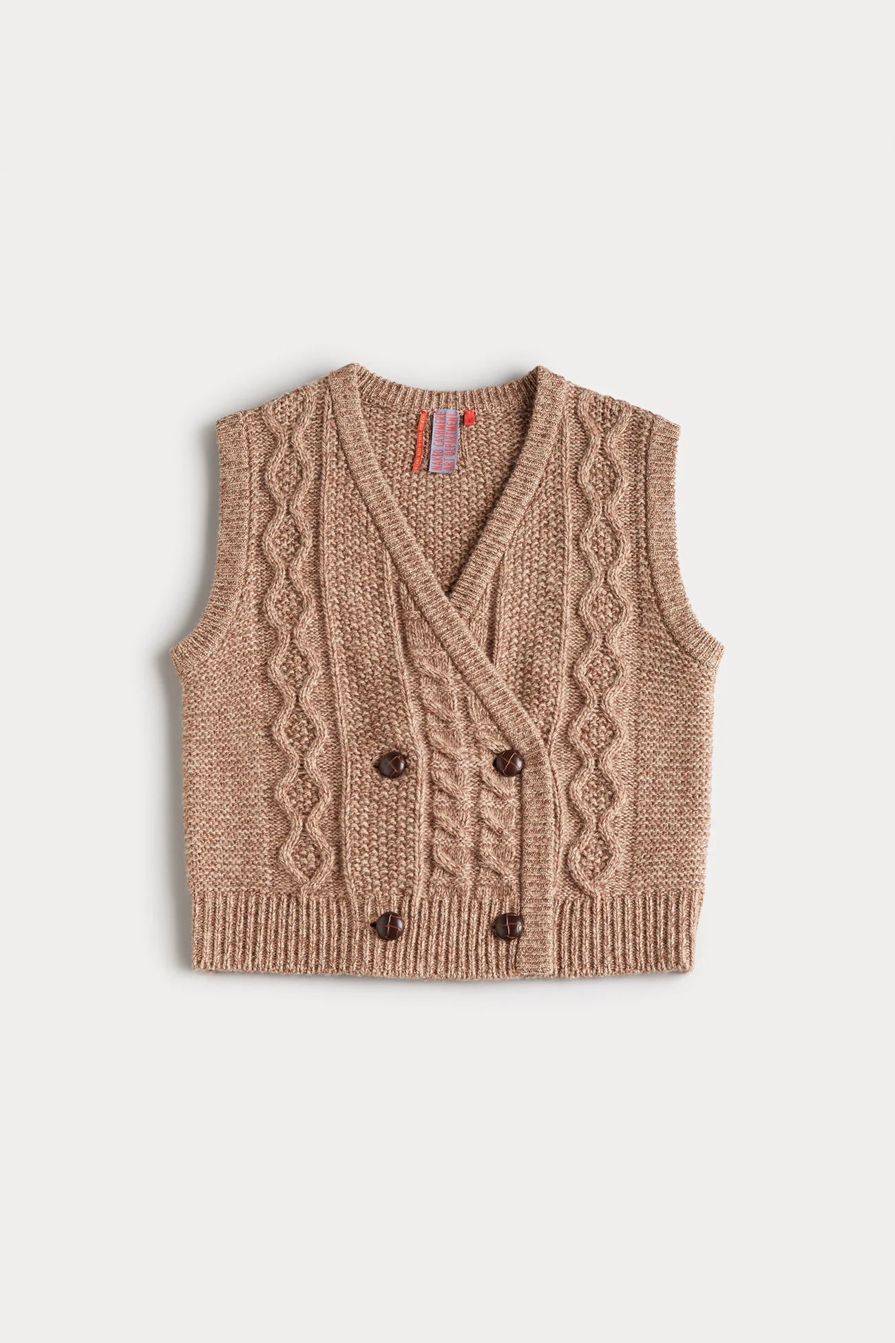 Knitted vest with cable pattern and button details on a light beige background