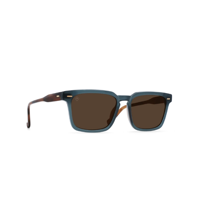 A pair of square-frame sunglasses with a translucent slate blue acetate frame, dark brown lenses, and tortoiseshell temples, shown on a plain white background. - 2