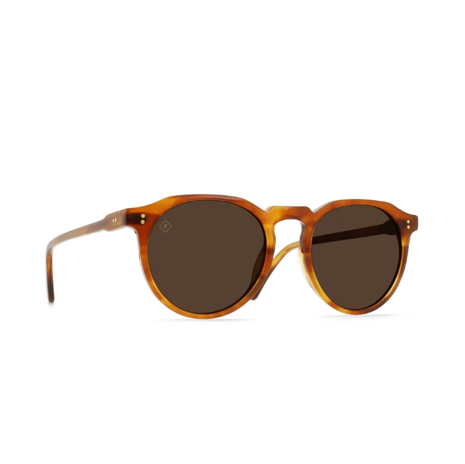 Round sunglasses with a translucent amber-brown acetate frame and dark brown lenses, shown from a three-quarters angle on a white background. - 2